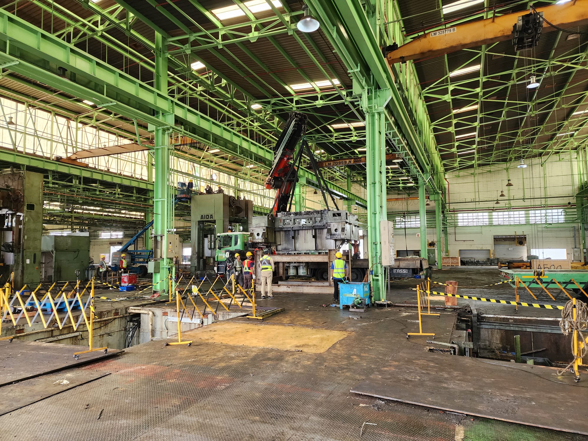 Machine lifting and removal from factory